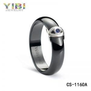 Ceramic wedding rings with blue cubic zirconia inlay