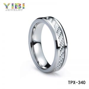 Tungsten engagement ring with carbon fiber inlay