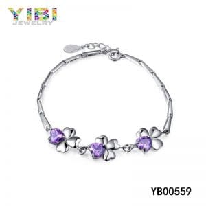 Elegant brass bracelet with synthetic amethyst stone inlay