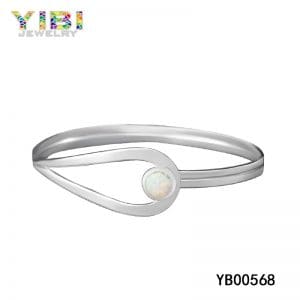 Modern brass bracelet with white fire opal inlaid