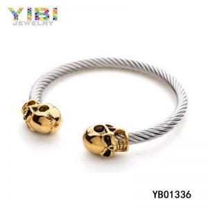 Surgical Stainless Steel Cable Bangle with Gold Plated Skulls